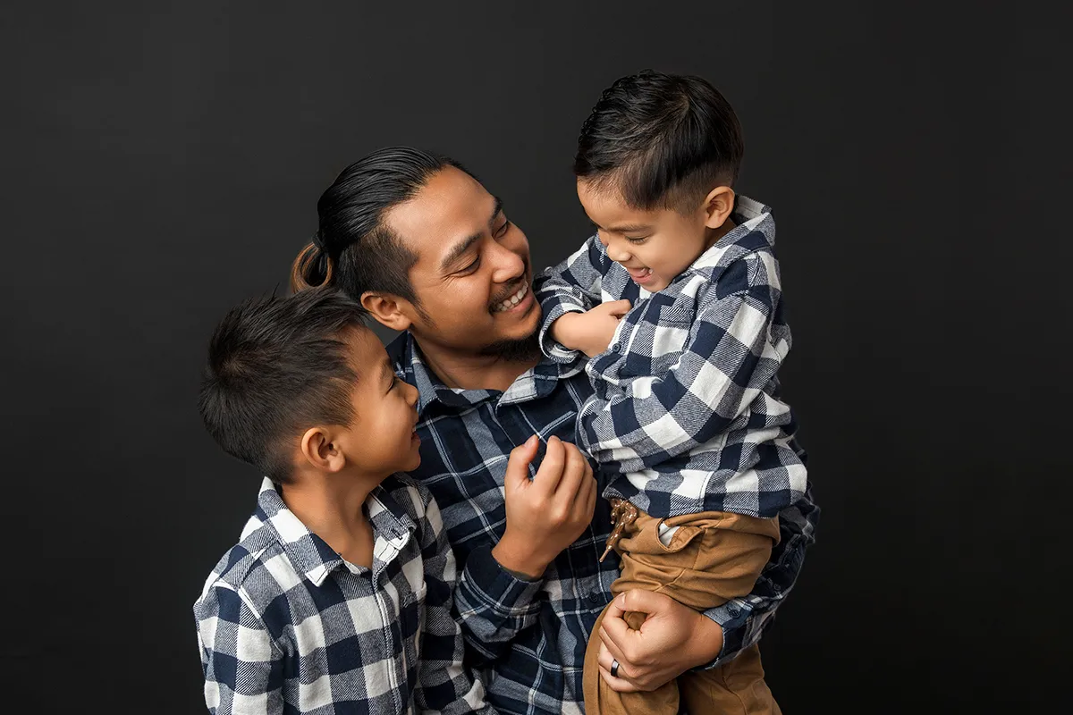 Family photography session with parents and child at Photo Hive Auckland