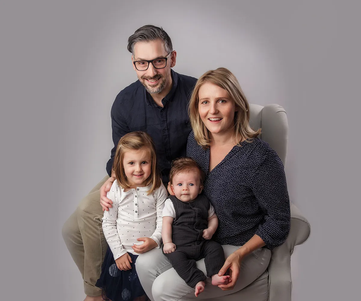 Warm connected family portrait photographed by Photo Hive in Auckland